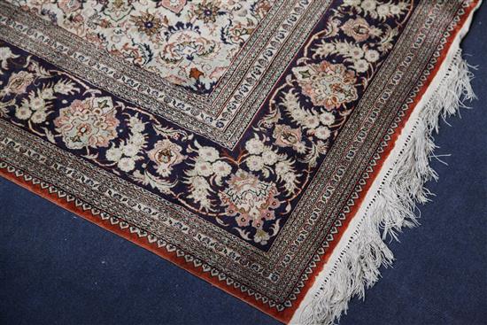 A Chinese silk pink ground rug, 6ft by 4ft.